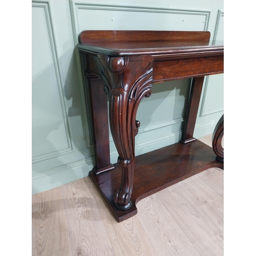 28 - Good quality William IV rosewood console table with gallery back raised on carved shaped legs on pla... 