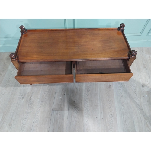 298 - 19th C. Mahogany two drawer coffee table. {57 cm H x 122 cm W x 48 cm D}.