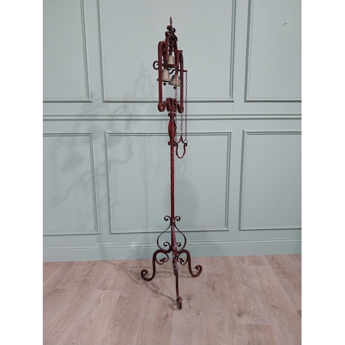 318 - Unusual decorative wrought iron house bell on single column with tripod base. {176 cm H x 50 cm Dia.... 