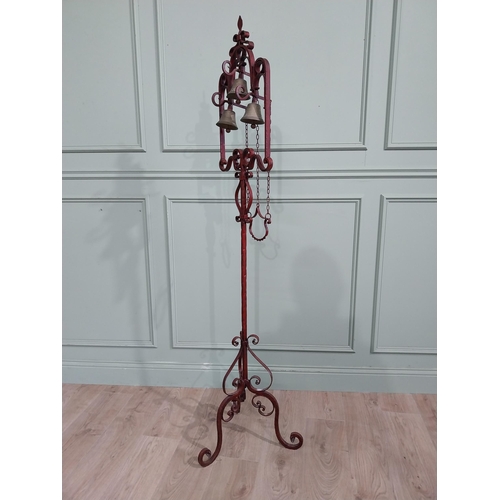 318 - Unusual decorative wrought iron house bell on single column with tripod base. {176 cm H x 50 cm Dia.... 