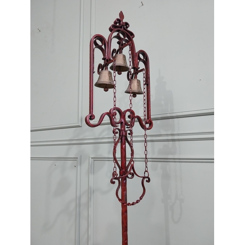 318 - Unusual decorative wrought iron house bell on single column with tripod base. {176 cm H x 50 cm Dia.... 