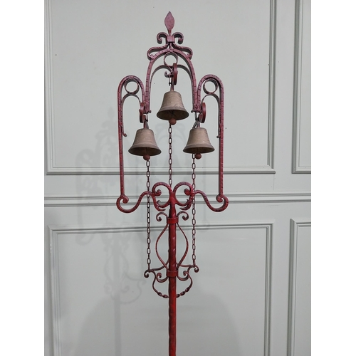 318 - Unusual decorative wrought iron house bell on single column with tripod base. {176 cm H x 50 cm Dia.... 