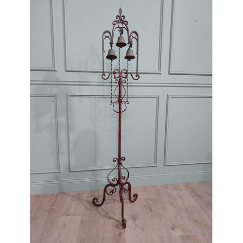 318 - Unusual decorative wrought iron house bell on single column with tripod base. {176 cm H x 50 cm Dia.... 