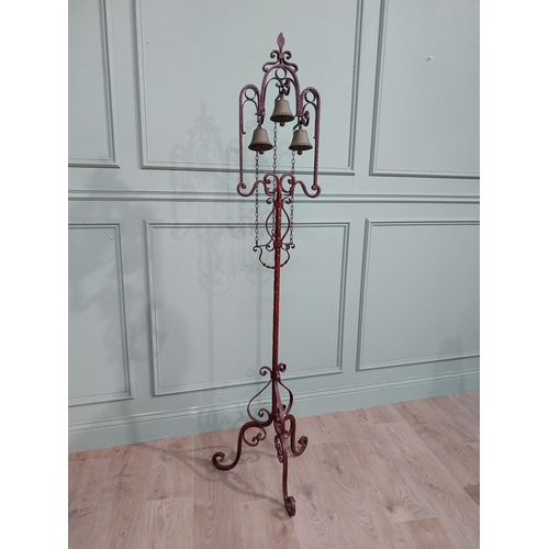 318 - Unusual decorative wrought iron house bell on single column with tripod base. {176 cm H x 50 cm Dia.... 