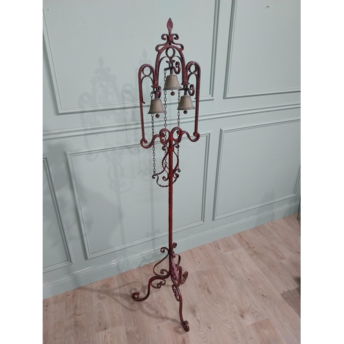 318 - Unusual decorative wrought iron house bell on single column with tripod base. {176 cm H x 50 cm Dia.... 