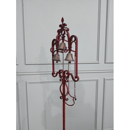 318 - Unusual decorative wrought iron house bell on single column with tripod base. {176 cm H x 50 cm Dia.... 