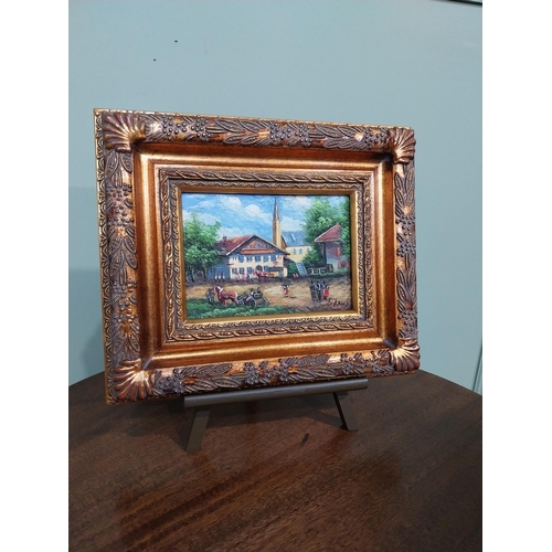 323 - Pair of oleographs mounted on ornate gilt framed oil on easel stands � Village Scene and Cafe Scene.... 