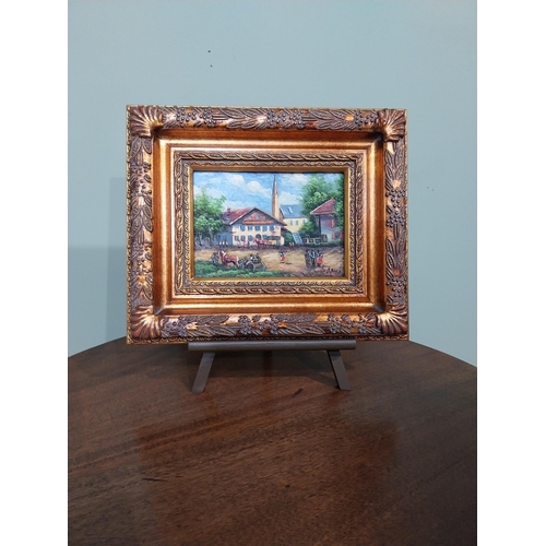 323 - Pair of oleographs mounted on ornate gilt framed oil on easel stands � Village Scene and Cafe Scene.... 