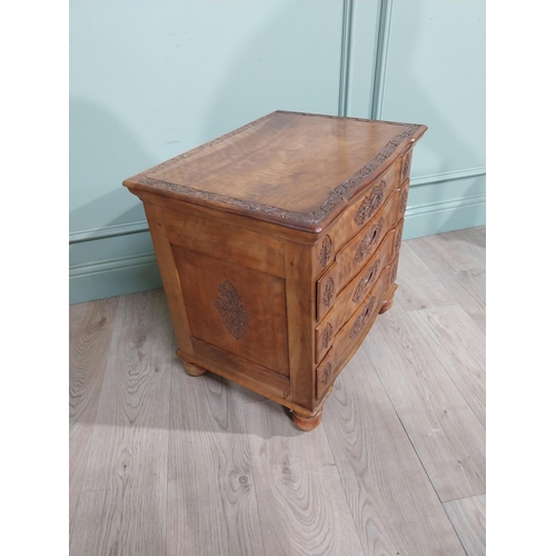 324 - 1950�s camphor wood bank of drawers with fitted interior above three long drawers with leaf decorati... 