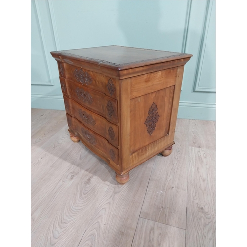 324 - 1950�s camphor wood bank of drawers with fitted interior above three long drawers with leaf decorati... 