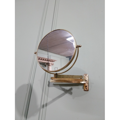 35 - Brass angle poise wall mounted mirror. {26 cm H x 30 cm W x 30 cm D}.