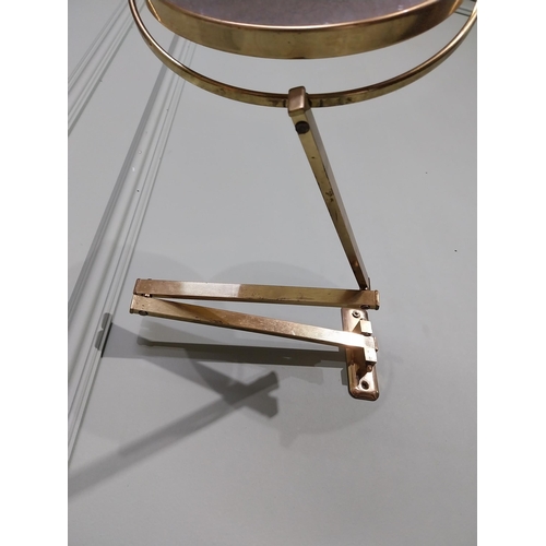 35 - Brass angle poise wall mounted mirror. {26 cm H x 30 cm W x 30 cm D}.