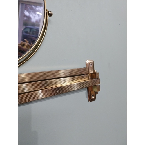 35 - Brass angle poise wall mounted mirror. {26 cm H x 30 cm W x 30 cm D}.