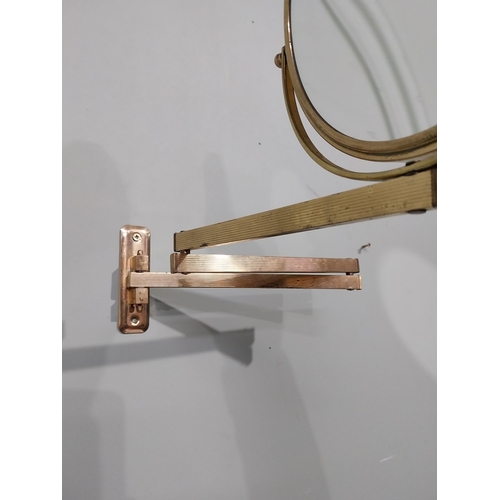 35 - Brass angle poise wall mounted mirror. {26 cm H x 30 cm W x 30 cm D}.