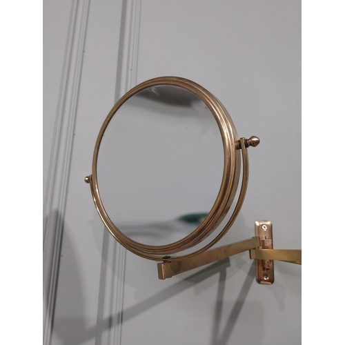 35 - Brass angle poise wall mounted mirror. {26 cm H x 30 cm W x 30 cm D}.