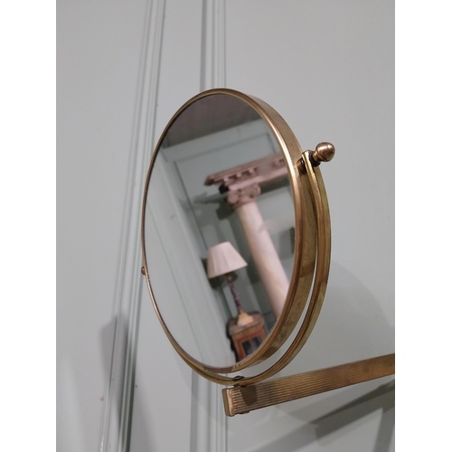 35 - Brass angle poise wall mounted mirror. {26 cm H x 30 cm W x 30 cm D}.