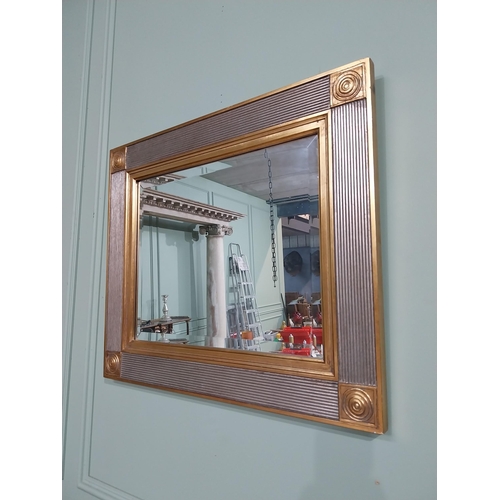 380 - Decorative gilt wall mirror. {58 cm H x 68 cm W}.