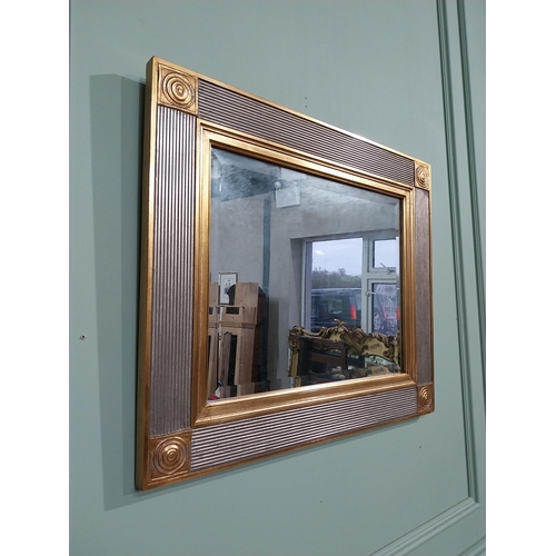 380 - Decorative gilt wall mirror. {58 cm H x 68 cm W}.