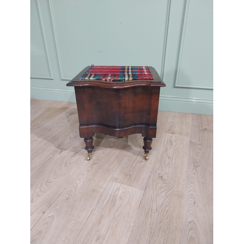 384 - 19th C. Mahogany commode with upholstered seat raised on turned legs and brass castors. {48 cm H x 4... 