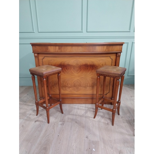 391 - Mahogany home bar counter with shaped reeded front with two mahogany and leather upholstered stools ... 