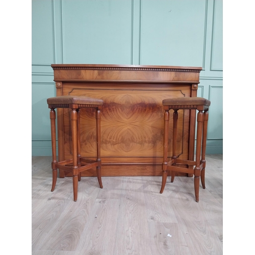 391 - Mahogany home bar counter with shaped reeded front with two mahogany and leather upholstered stools ... 