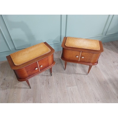 396 - Pair of Italian mid century walnut and maple two door bedside lockers raised on tapered legs and bra... 