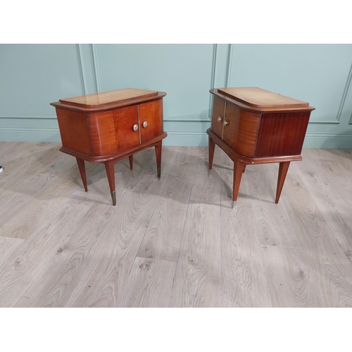 396 - Pair of Italian mid century walnut and maple two door bedside lockers raised on tapered legs and bra... 