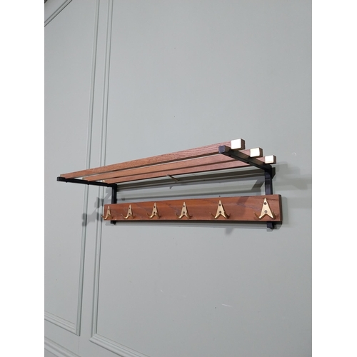 400 - Mid century teak and brass luggage rack. {19 cm H x 75 cm W x 25 cm D}.