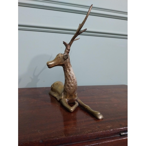 403 - Brass model of seated Stag. {30 cm H x 32 cm W x 13 cm D}.