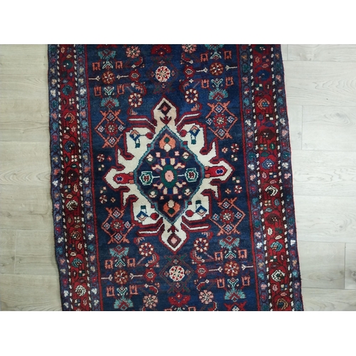 405 - Decorative Persian carpet runner. {290 cm H x 110 cm W}.