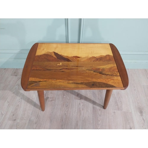 407 - 1950's satinwood coffee table on splayed legs with inset island scene. {47 cm H x 71 cm W x 43 cm D]... 