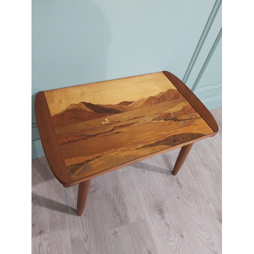 407 - 1950's satinwood coffee table on splayed legs with inset island scene. {47 cm H x 71 cm W x 43 cm D]... 