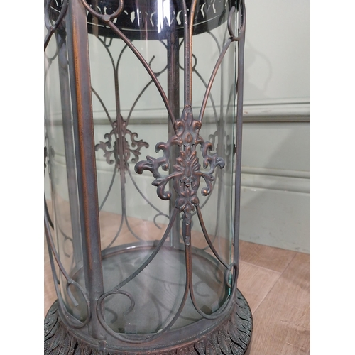 41 - Pair of decorative metal lanterns. {64 cm H x 24 cm Dia.}.