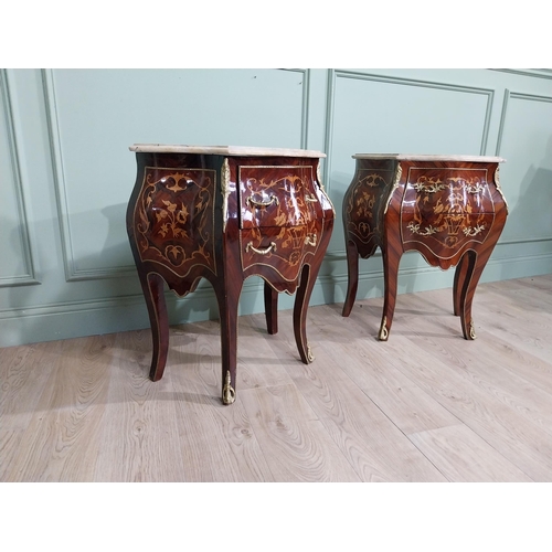 45 - Pair of inlaid kingwood bow fronted bedside cabinets with marble tops and decorated with ormolu moun... 