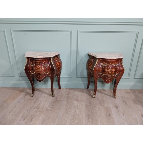 45 - Pair of inlaid kingwood bow fronted bedside cabinets with marble tops and decorated with ormolu moun... 