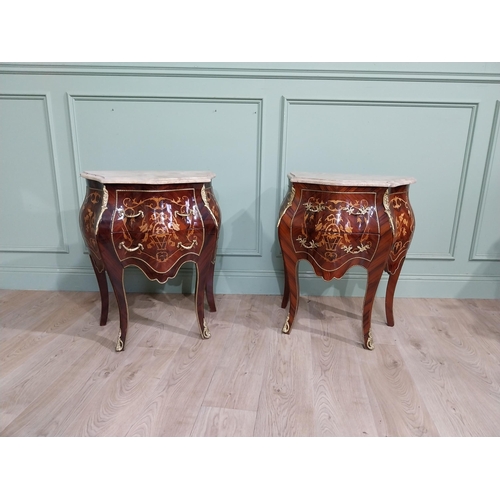 45 - Pair of inlaid kingwood bow fronted bedside cabinets with marble tops and decorated with ormolu moun... 