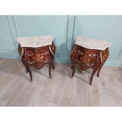 45 - Pair of inlaid kingwood bow fronted bedside cabinets with marble tops and decorated with ormolu moun... 