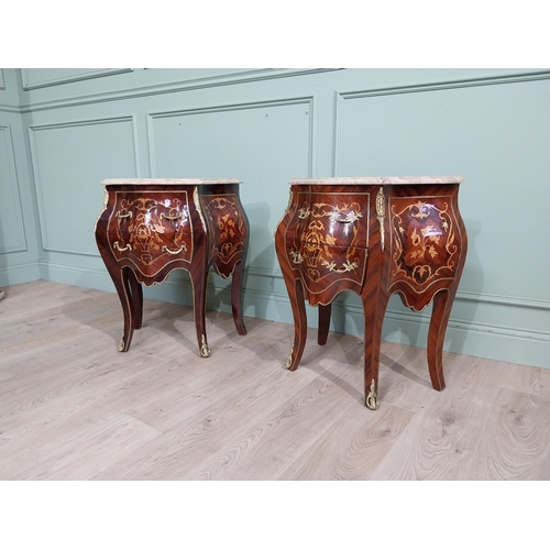 45 - Pair of inlaid kingwood bow fronted bedside cabinets with marble tops and decorated with ormolu moun... 