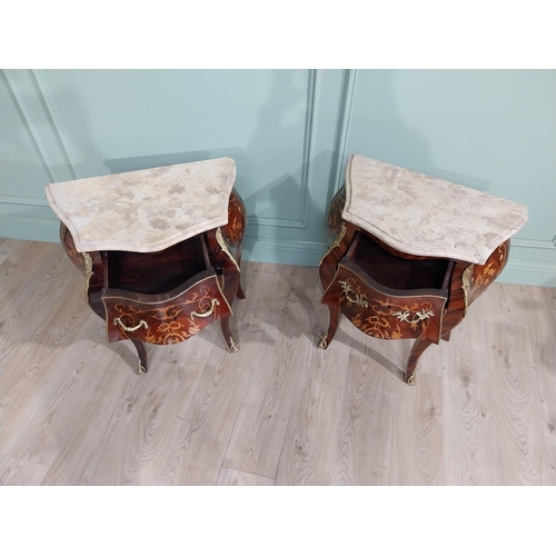 45 - Pair of inlaid kingwood bow fronted bedside cabinets with marble tops and decorated with ormolu moun... 