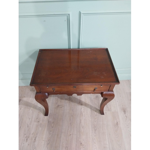 465 - Edwardian mahogany silver table with brushing slide and single drawer in frieze raised on shaped leg... 