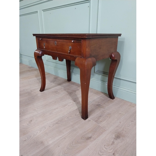 465 - Edwardian mahogany silver table with brushing slide and single drawer in frieze raised on shaped leg... 