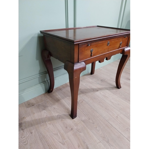 465 - Edwardian mahogany silver table with brushing slide and single drawer in frieze raised on shaped leg... 