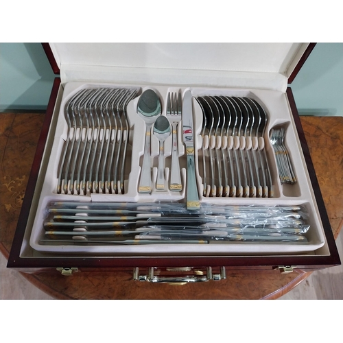 47 - Prima cutlery set in mahogany display case. {14 cm H x 46 cm W x 34 cm D}.