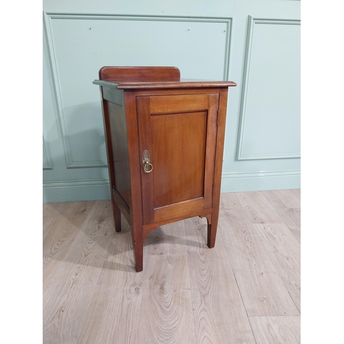 477 - Edwardian mahogany bedside locker with gallery back and single door raised on tapered legs. {82 cm H... 