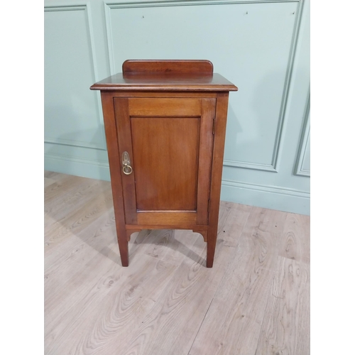 477 - Edwardian mahogany bedside locker with gallery back and single door raised on tapered legs. {82 cm H... 