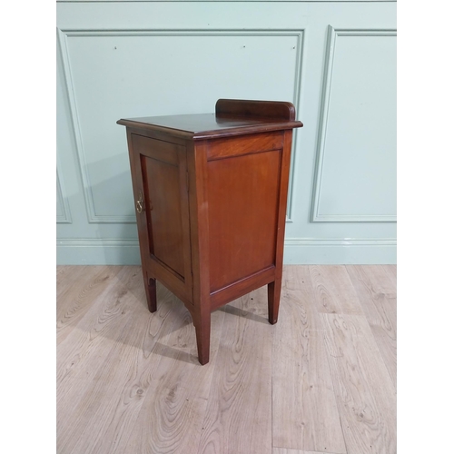 477 - Edwardian mahogany bedside locker with gallery back and single door raised on tapered legs. {82 cm H... 