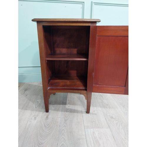 477 - Edwardian mahogany bedside locker with gallery back and single door raised on tapered legs. {82 cm H... 