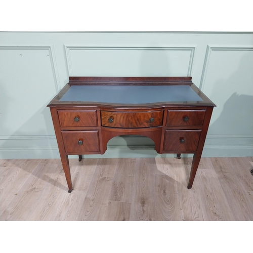 483 - 1950�s walnut kneehole desk with tooled leather top raised on tapered legs. {85 cm H x 105 cm W x 48... 