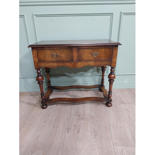 485 - Edwardian walnut side table in the Tudor style with two drawers in frieze raised on turned legs. {77... 