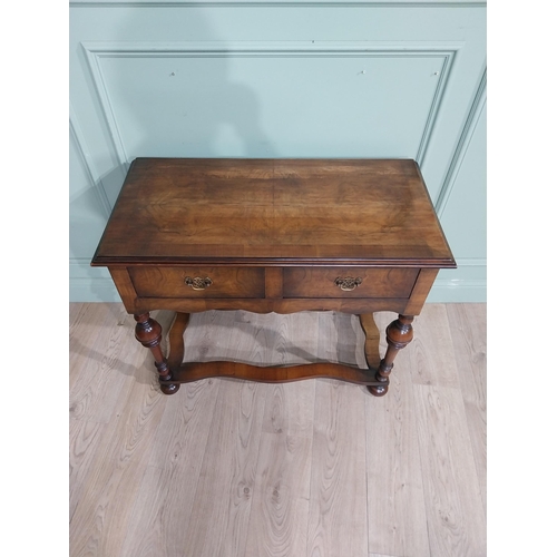 485 - Edwardian walnut side table in the Tudor style with two drawers in frieze raised on turned legs. {77... 